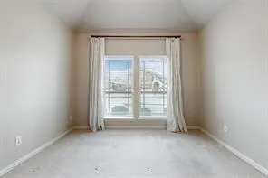 an empty room with entrance door