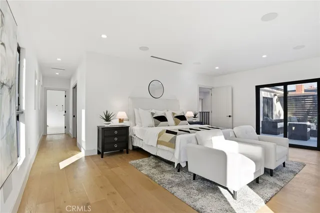 a bed room with bed and a large window