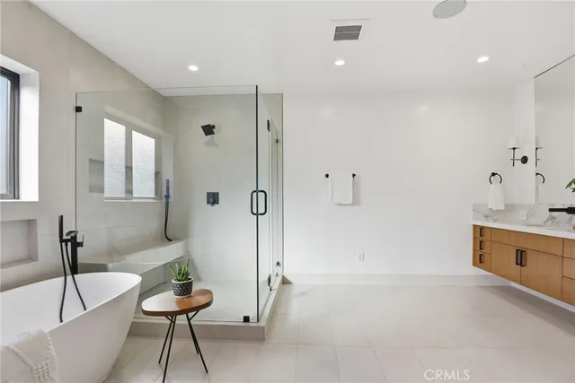 a bathroom with a tub and a sink