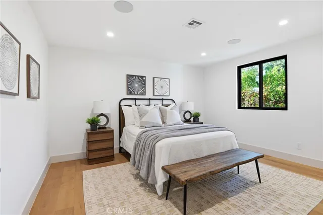 a bedroom with a bed and a table