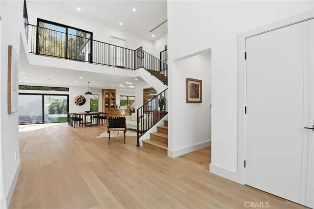 a view of a livingroom with furniture and hardwood floor