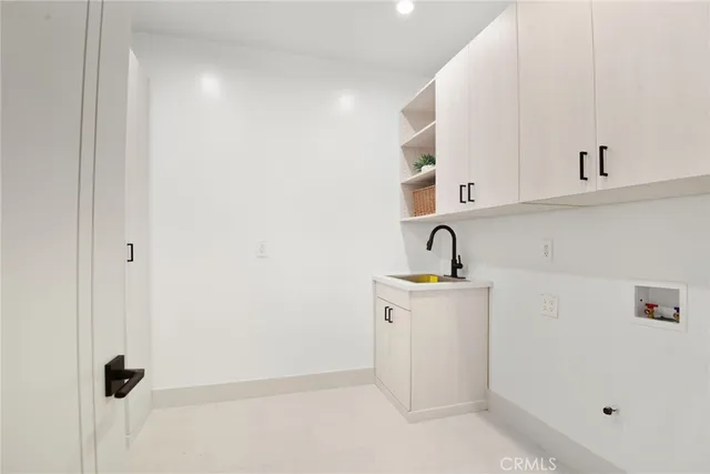 a view of storage and utility room with closet