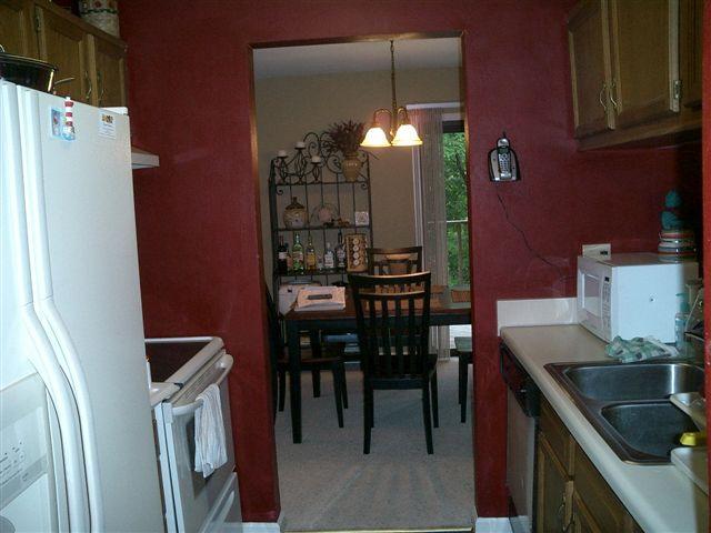 3335 Forest Ridge Road Roanoke, VA 24018 - Photo 5 of 22 a kitchen with a table chairs and a refrigerator