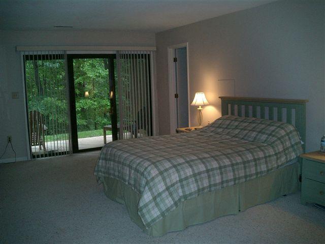 3335 Forest Ridge Road Roanoke, VA 24018 - Photo 8 of 22 a bedroom with a bed lamp and window