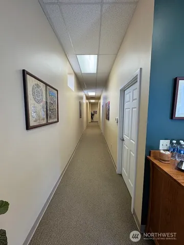 a view of a hallway with workspace