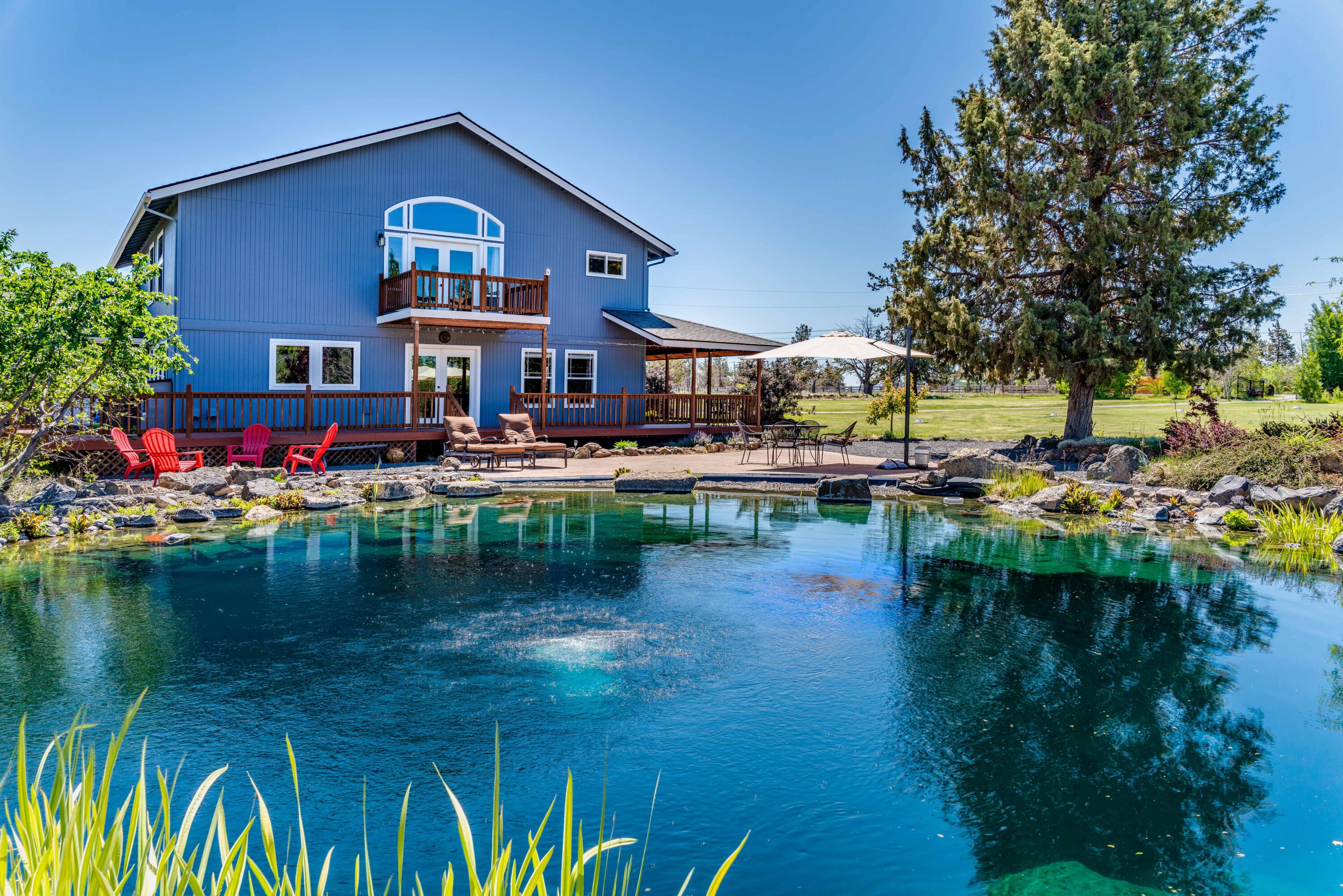 22234 Nelson Road Bend, OR 97701 - Photo 4 of 60 a view of residential house with outdoor space and lake view