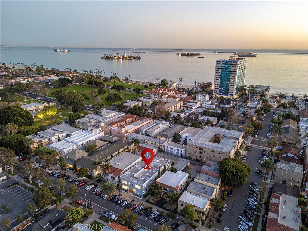 an aerial view of a city with ocean view