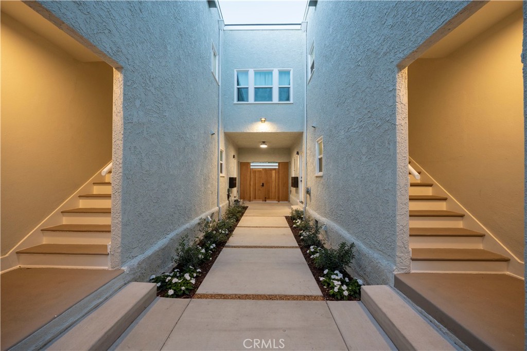 1820 2nd Street Long Beach, CA 90802 - Photo 5 of 16 a view of a hallway with wooden floor and staircase