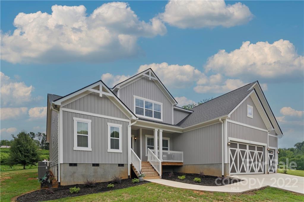 640 Pigeon Ford Road Canton, NC 28716 - Photo 1 of 30 a front view of a house with garden