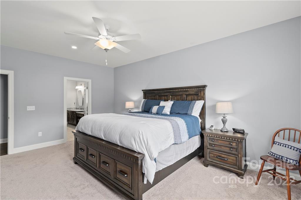 640 Pigeon Ford Road Canton, NC 28716 - Photo 13 of 30 a bedroom with a bed and lamp on dresser