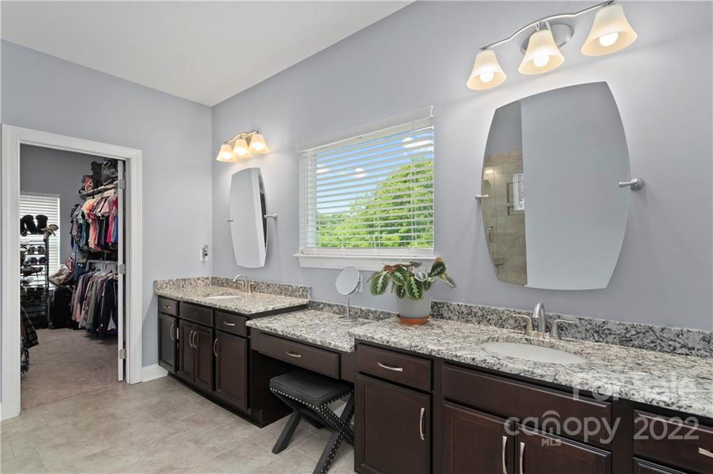 640 Pigeon Ford Road Canton, NC 28716 - Photo 14 of 30 a bathroom with a granite countertop sink and a mirror