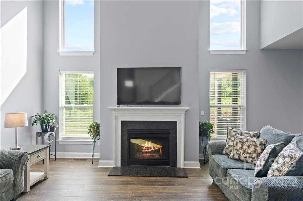640 Pigeon Ford Road Canton, NC 28716 - Photo 5 of 30 a living room with furniture a flat screen tv and a fireplace