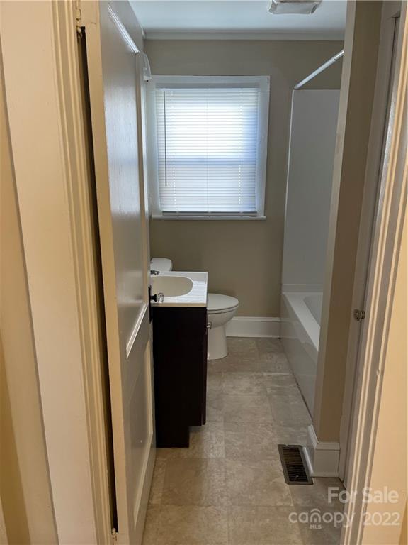607 Salisbury Road Statesville, NC 28677 - Photo 14 of 20 a bathroom with a sink and a mirror