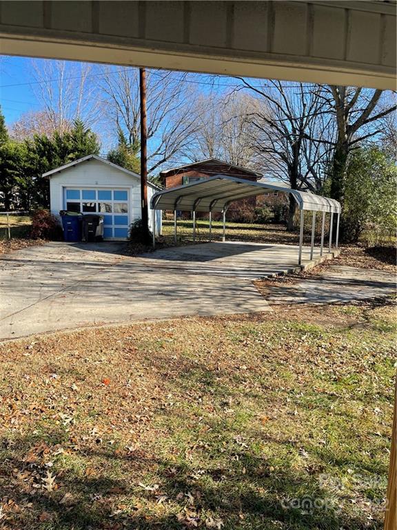 607 Salisbury Road Statesville, NC 28677 - Photo 20 of 20 a front view of a house with a yard and car parked