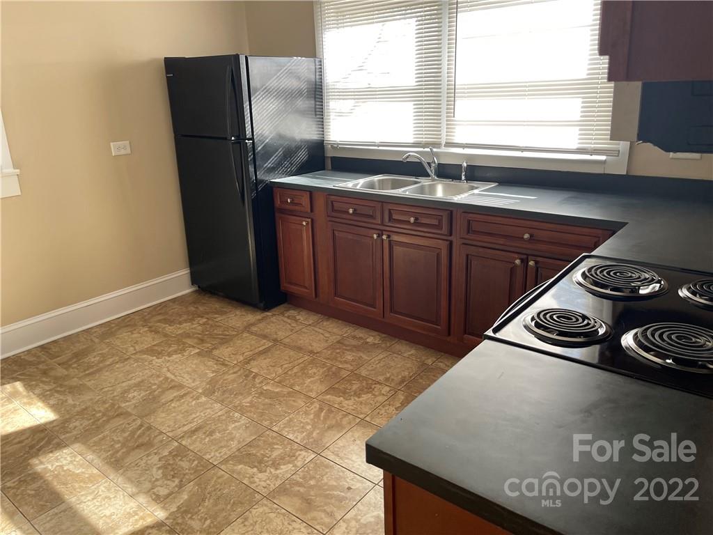 607 Salisbury Road Statesville, NC 28677 - Photo 2 of 20 a kitchen with stainless steel appliances granite countertop a sink stove and refrigerator