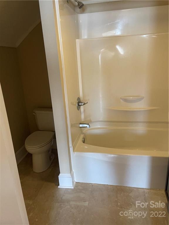 607 Salisbury Road Statesville, NC 28677 - Photo 9 of 20 a bathroom with a bathtub and a toilet