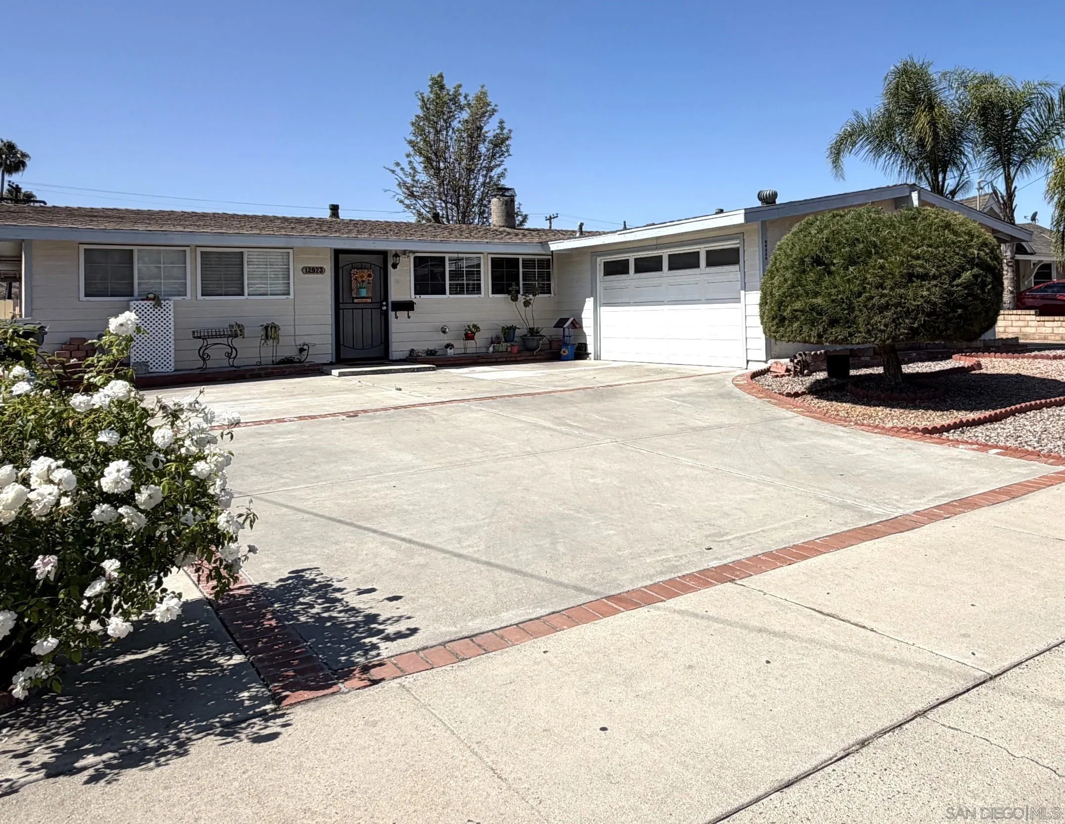 12923 Slack Street Poway, CA 92064 - Photo 1 of 29 a front view of a house with a yard