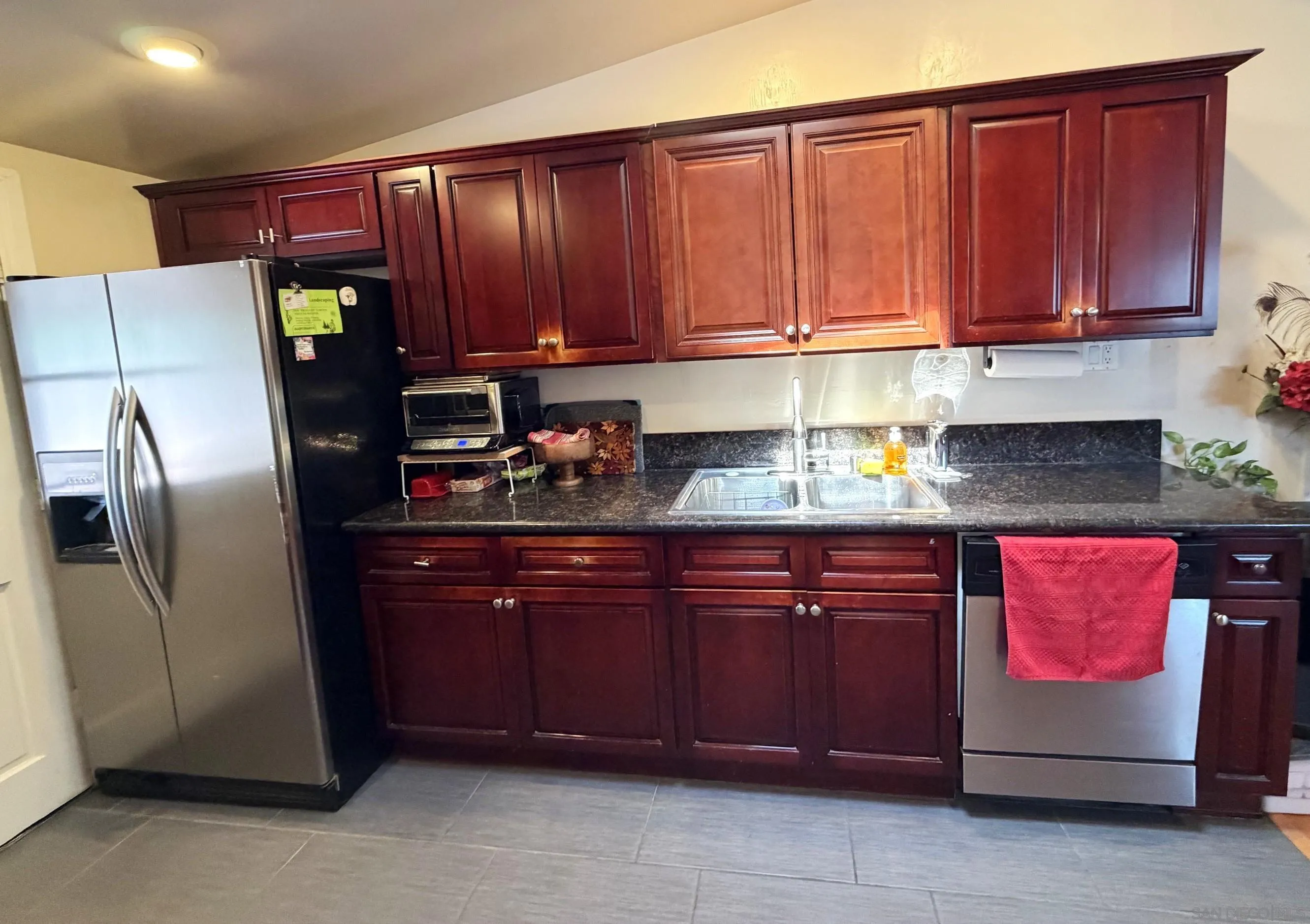 12923 Slack Street Poway, CA 92064 - Photo 12 of 29 a kitchen with stainless steel appliances granite countertop a refrigerator and stove