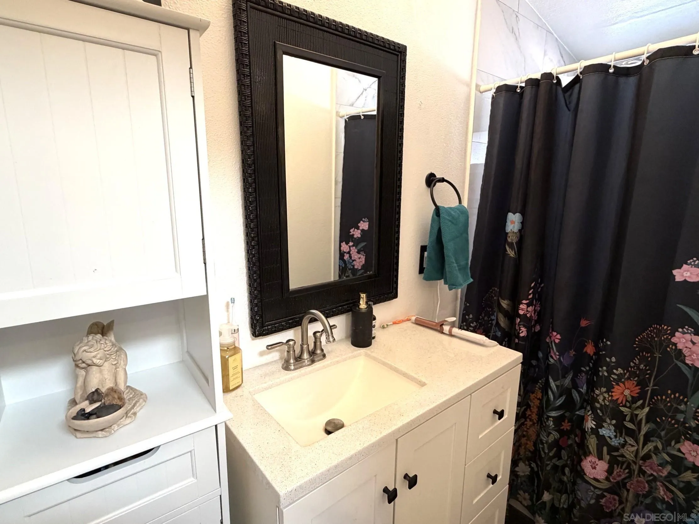 12923 Slack Street Poway, CA 92064 - Photo 15 of 29 a bathroom with a sink and a mirror