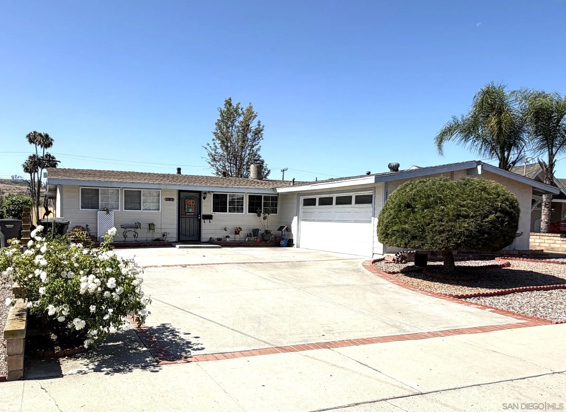 12923 Slack Street Poway, CA 92064 - Photo 2 of 29 a view of a house with a yard