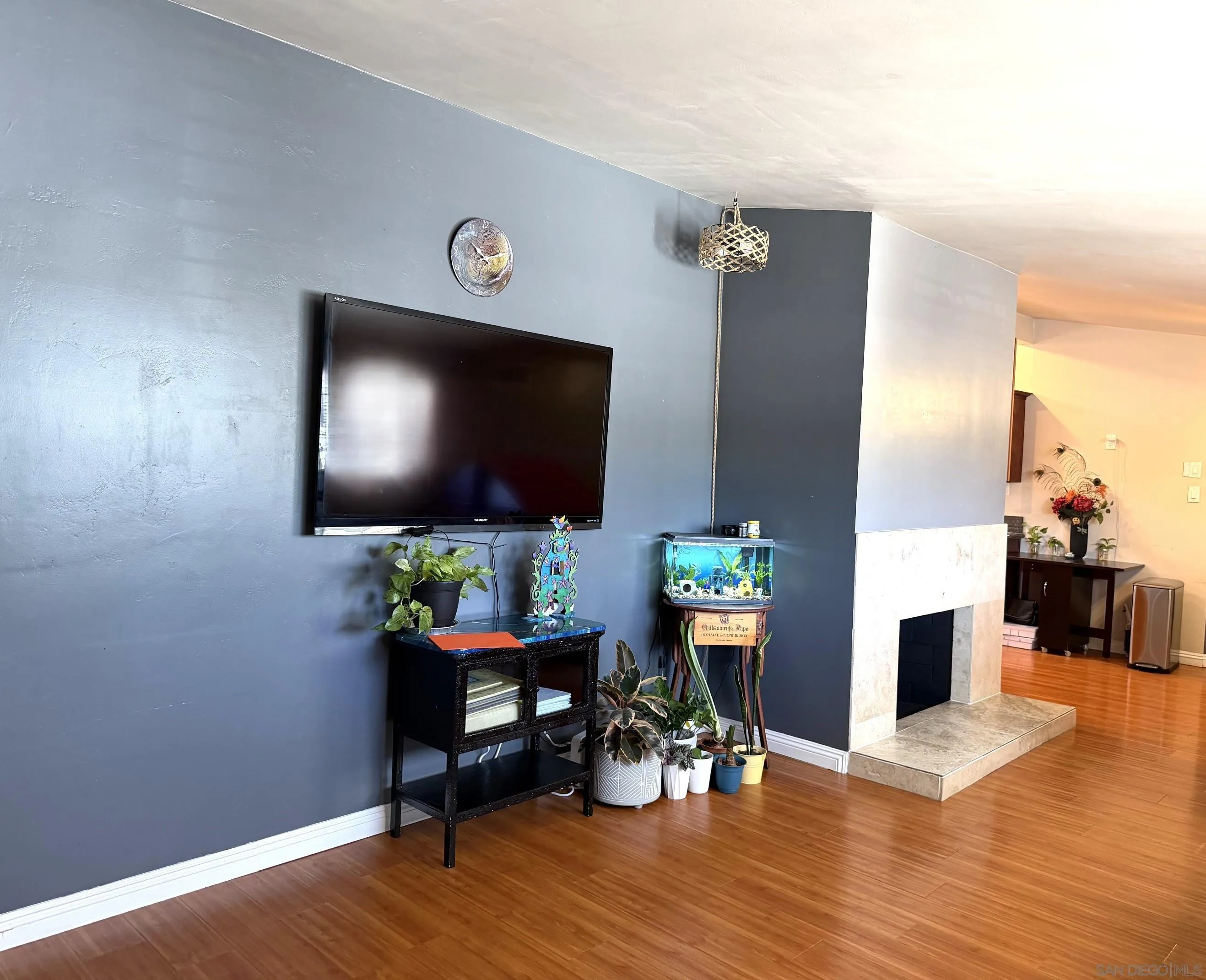 12923 Slack Street Poway, CA 92064 - Photo 4 of 29 a living room with furniture and a flat screen tv