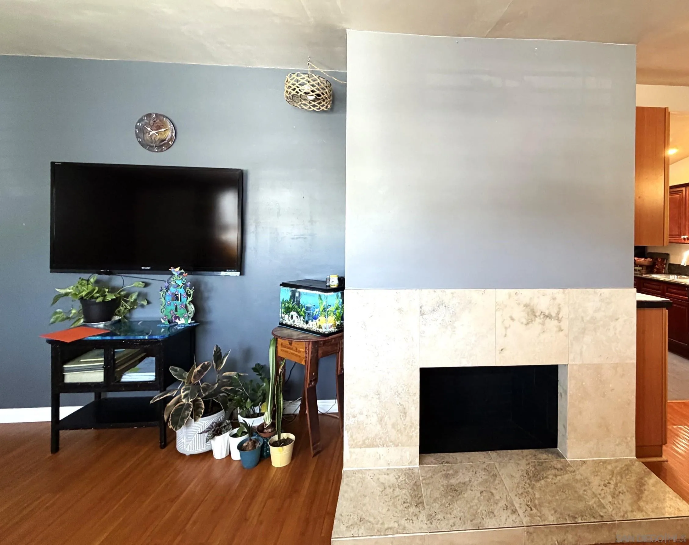 12923 Slack Street Poway, CA 92064 - Photo 7 of 29 a living room with furniture and a flat screen tv
