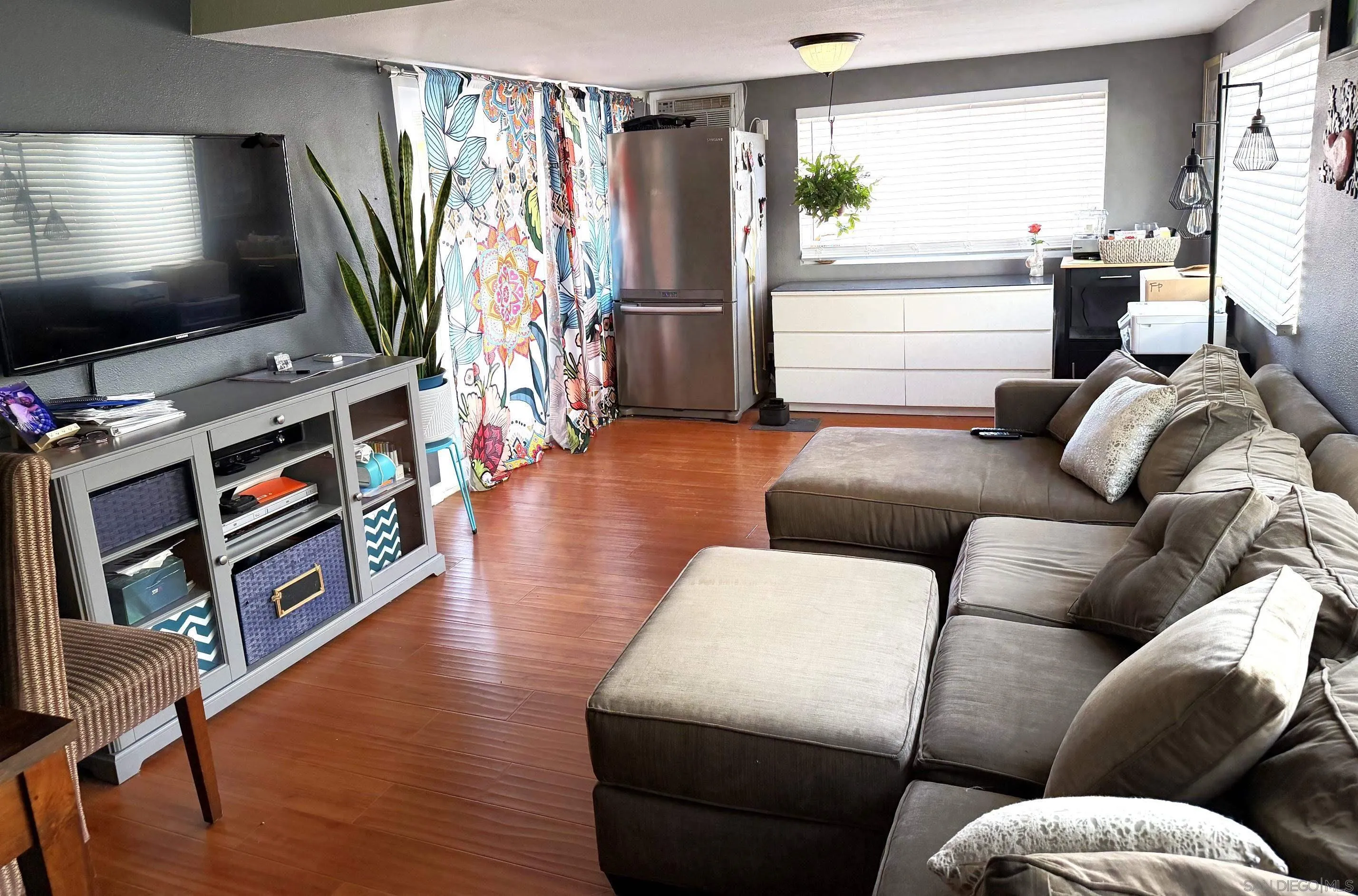 12923 Slack Street Poway, CA 92064 - Photo 8 of 29 a living room with furniture and a flat screen tv
