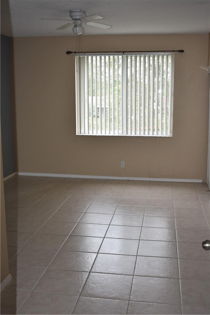 7890 Dixie Beach Circle Tamarac, FL 33321 - Photo 12 of 19 a view of a room that has a window in it