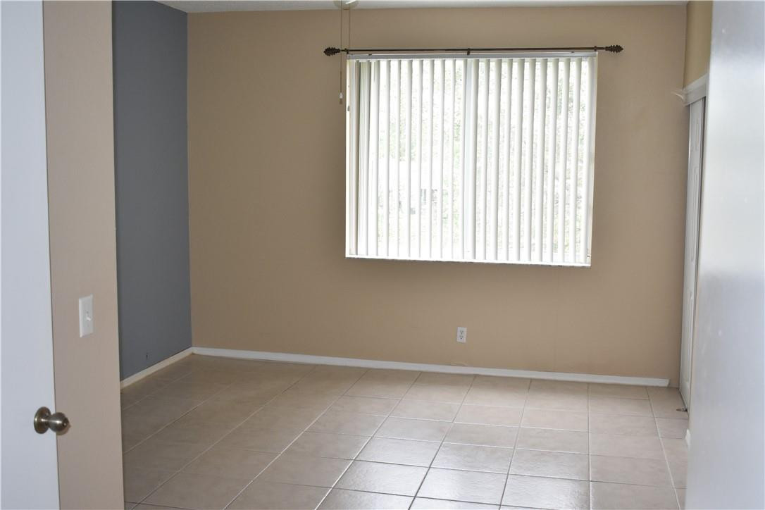 7890 Dixie Beach Circle Tamarac, FL 33321 - Photo 18 of 19 a view of an empty room with a window