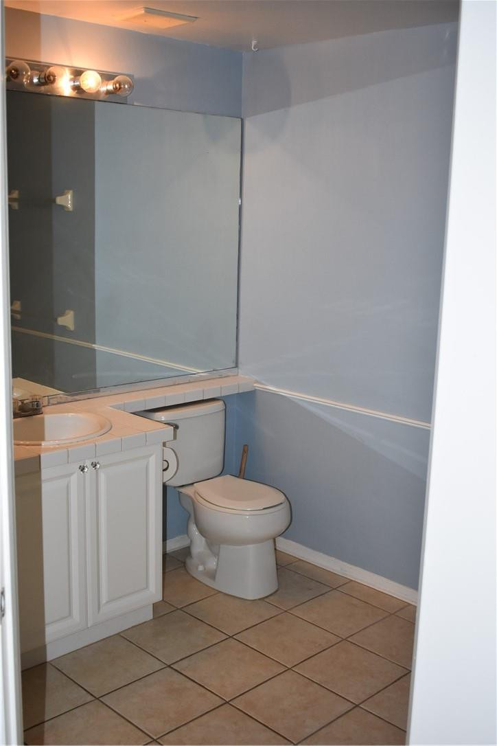 7890 Dixie Beach Circle Tamarac, FL 33321 - Photo 19 of 19 a bathroom with a toilet and a shower