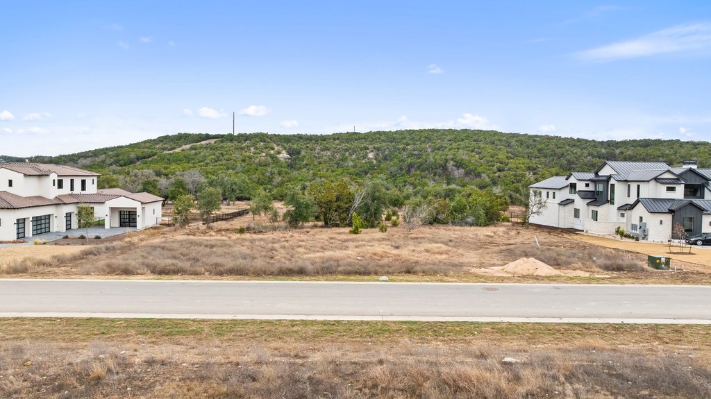 5408 Spring Preserve Trail Bee Cave, TX 78738 - Photo 21 of 40 a view of a house with a yard
