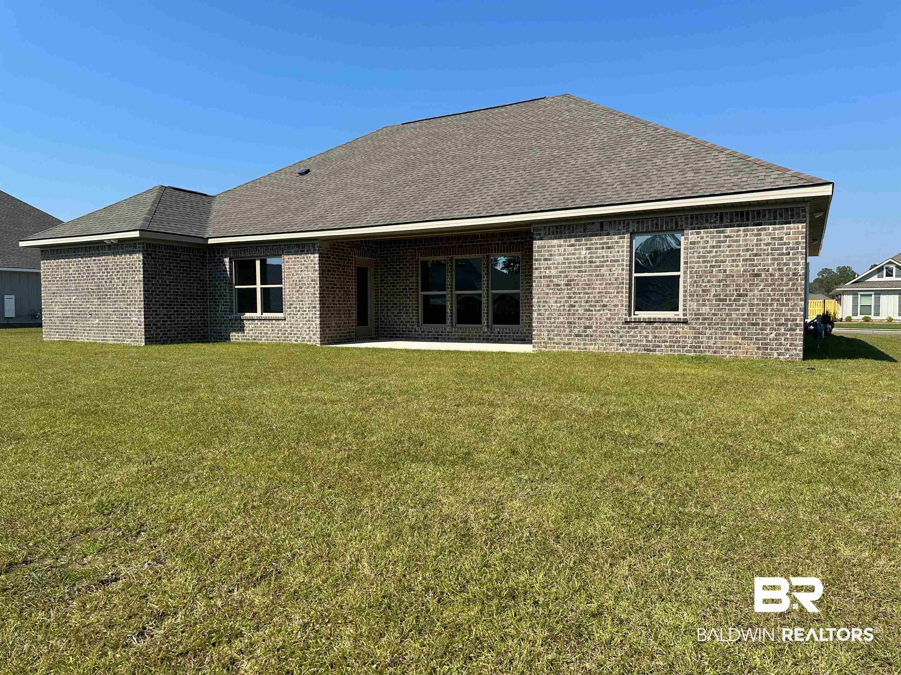 23548 Travis Stock Street, Unit 50 Foley, AL 36535 - Photo 7 of 30 Rear view of house with a yard