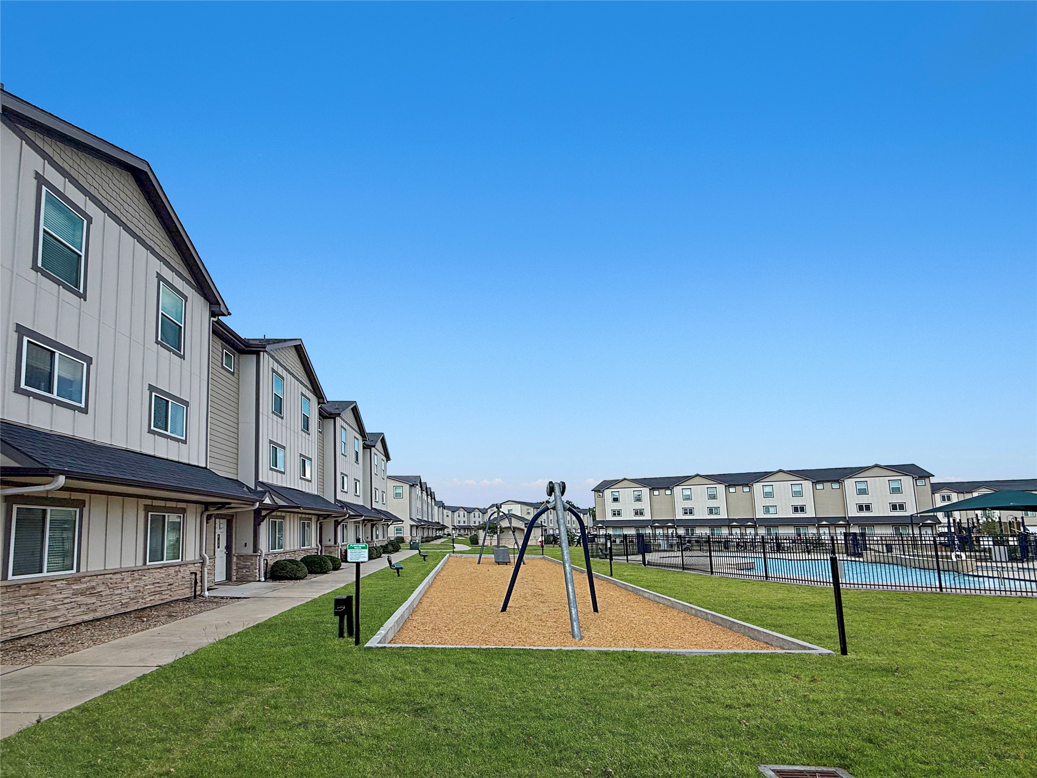 12603 Telge Road, Unit 8EH Cypress, TX 77429 - Photo 4 of 32 a view of a house with a yard