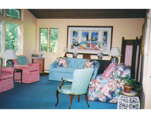 168 Sunset Road Carlisle, MA 01741 - Photo 6 of 6 a living room with furniture fireplace and a large window
