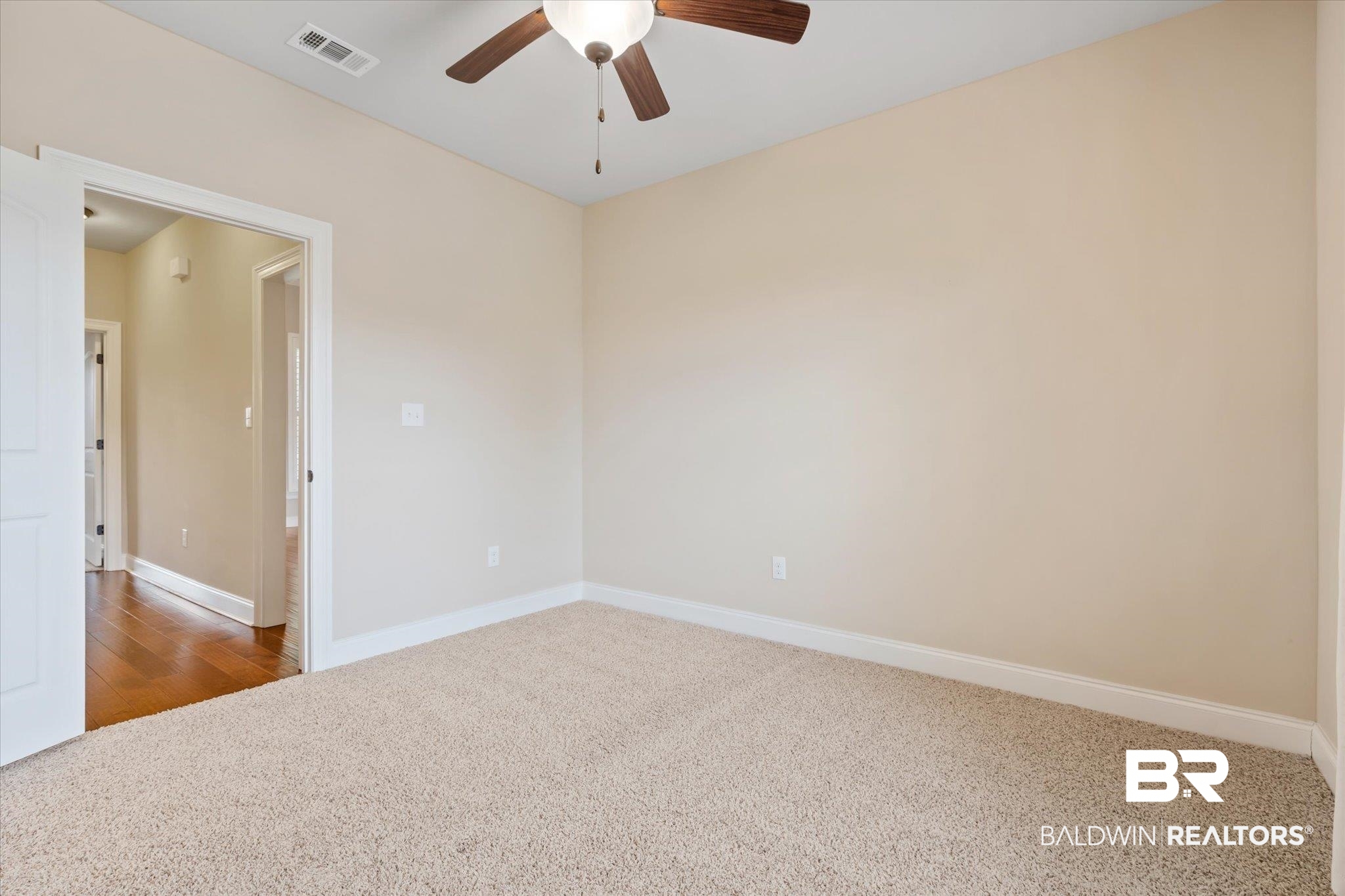 423 Breckin Drive Fairhope, AL 36532 - Photo 24 of 31 Spare room featuring wood-type flooring and ceiling fan
