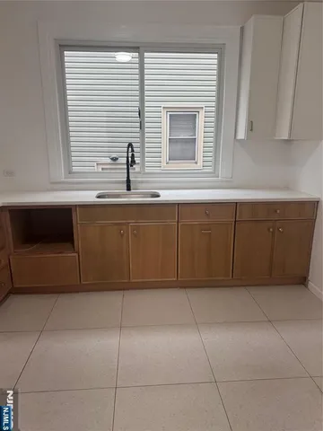 a kitchen with a cabinets and window