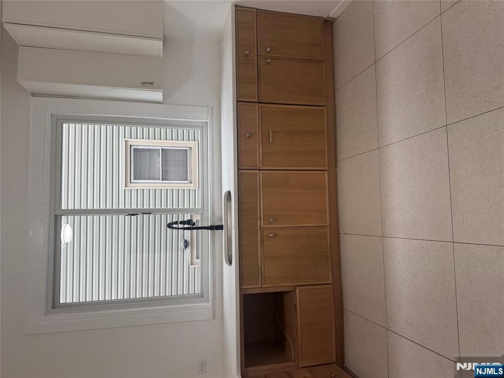 32 Jacoby Street, Unit 1 Maplewood, NJ 07040 - Photo 13 of 14 a kitchen with a cabinets and window