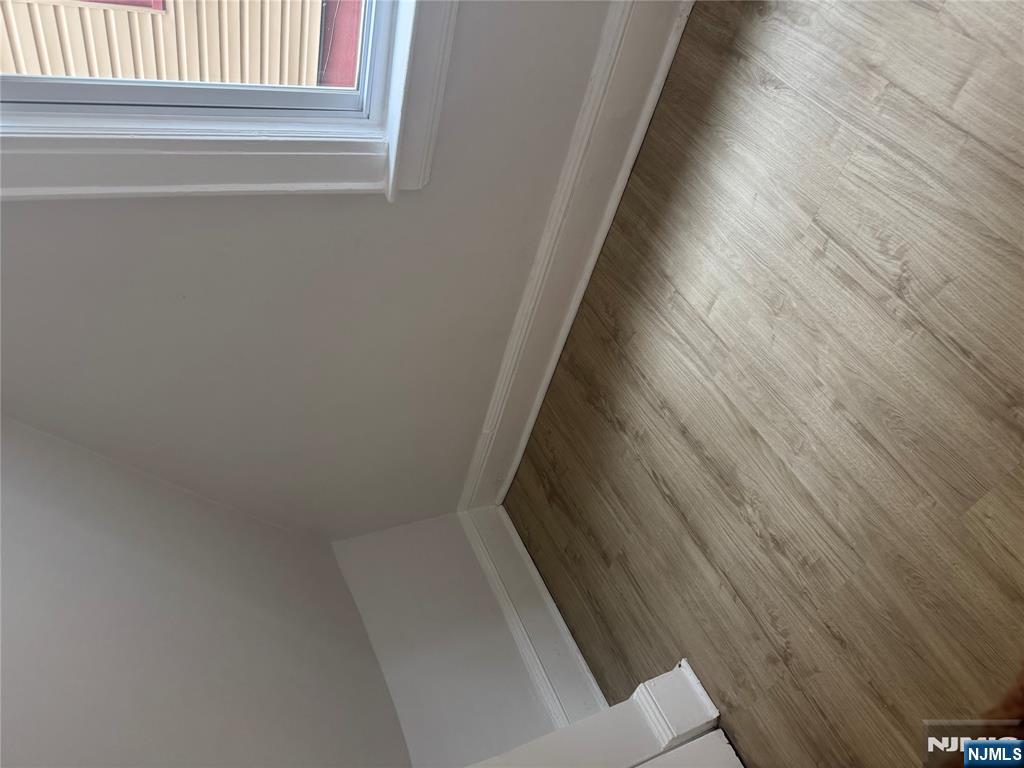 32 Jacoby Street, Unit 1 Maplewood, NJ 07040 - Photo 7 of 14 a view of a room with wooden floor and window