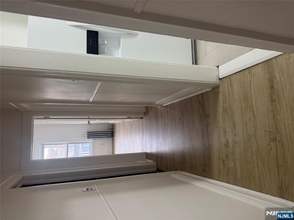 32 Jacoby Street, Unit 1 Maplewood, NJ 07040 - Photo 8 of 14 a view of a hallway with wooden floor