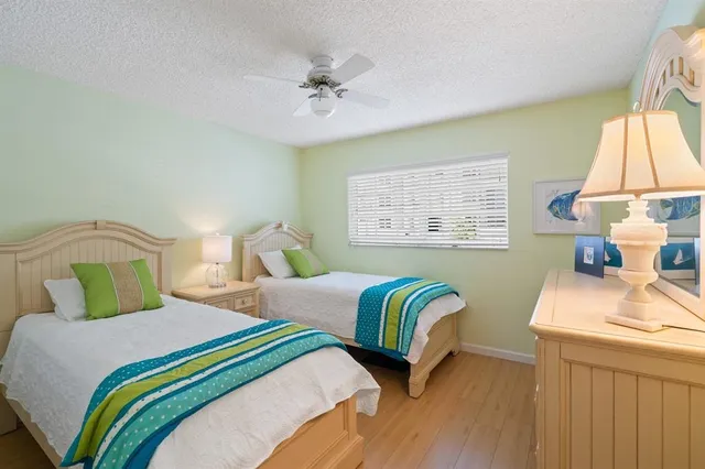 a bedroom with bed and a window