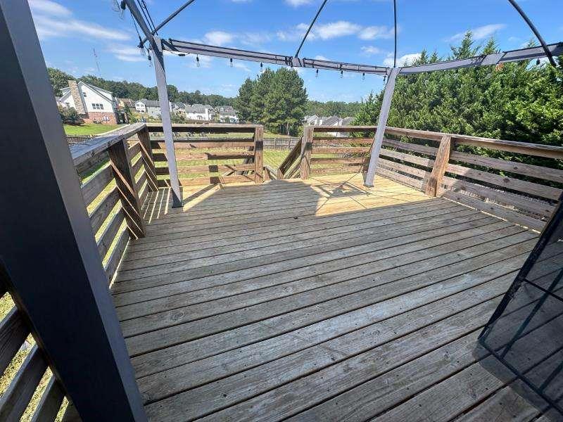 485 Brunswick Circle Stockbridge, GA 30281 - Photo 13 of 31 a view of a balcony with wooden floor