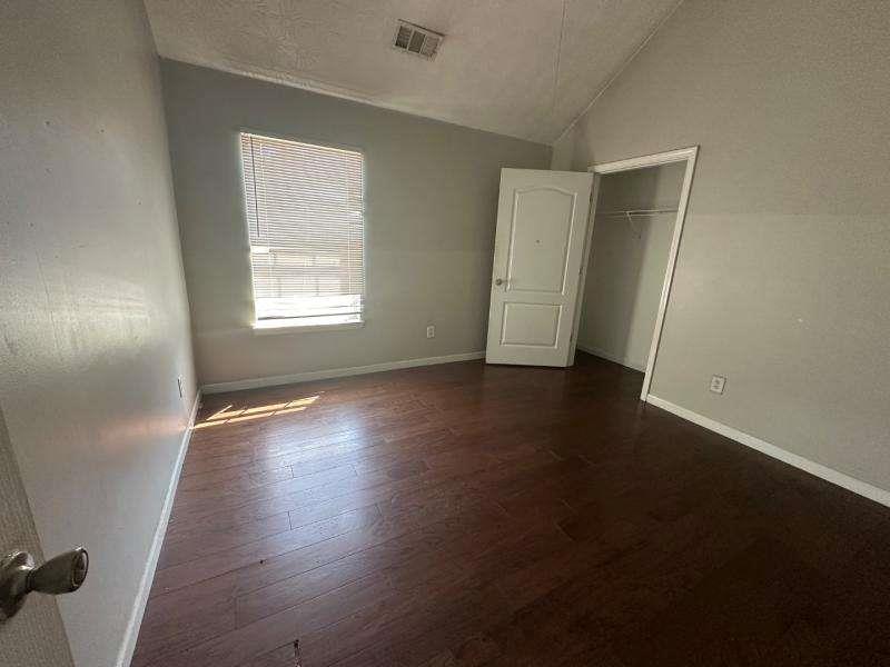 485 Brunswick Circle Stockbridge, GA 30281 - Photo 18 of 31 an empty room with wooden floor and windows