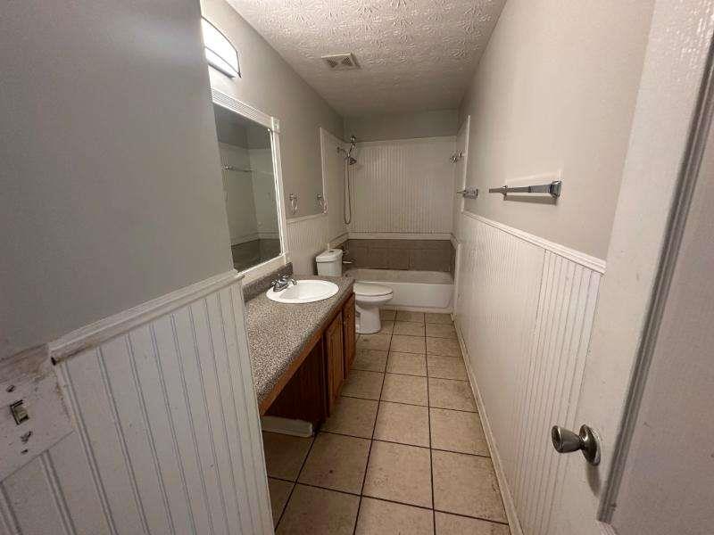 485 Brunswick Circle Stockbridge, GA 30281 - Photo 20 of 31 a bathroom with a sink a toilet and a shower