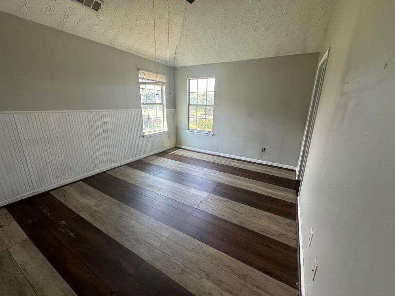 485 Brunswick Circle Stockbridge, GA 30281 - Photo 24 of 31 wooden floor in an empty room with a window