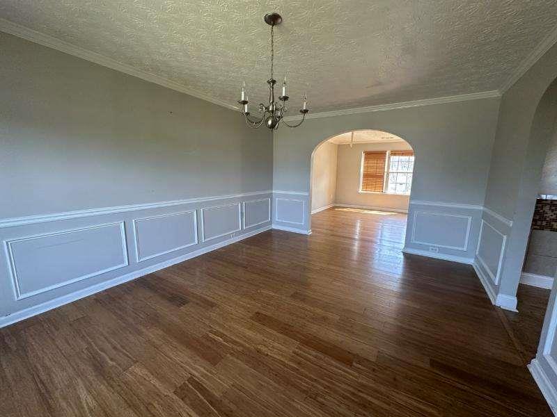 485 Brunswick Circle Stockbridge, GA 30281 - Photo 4 of 31 a view of empty room with wooden floor and fan