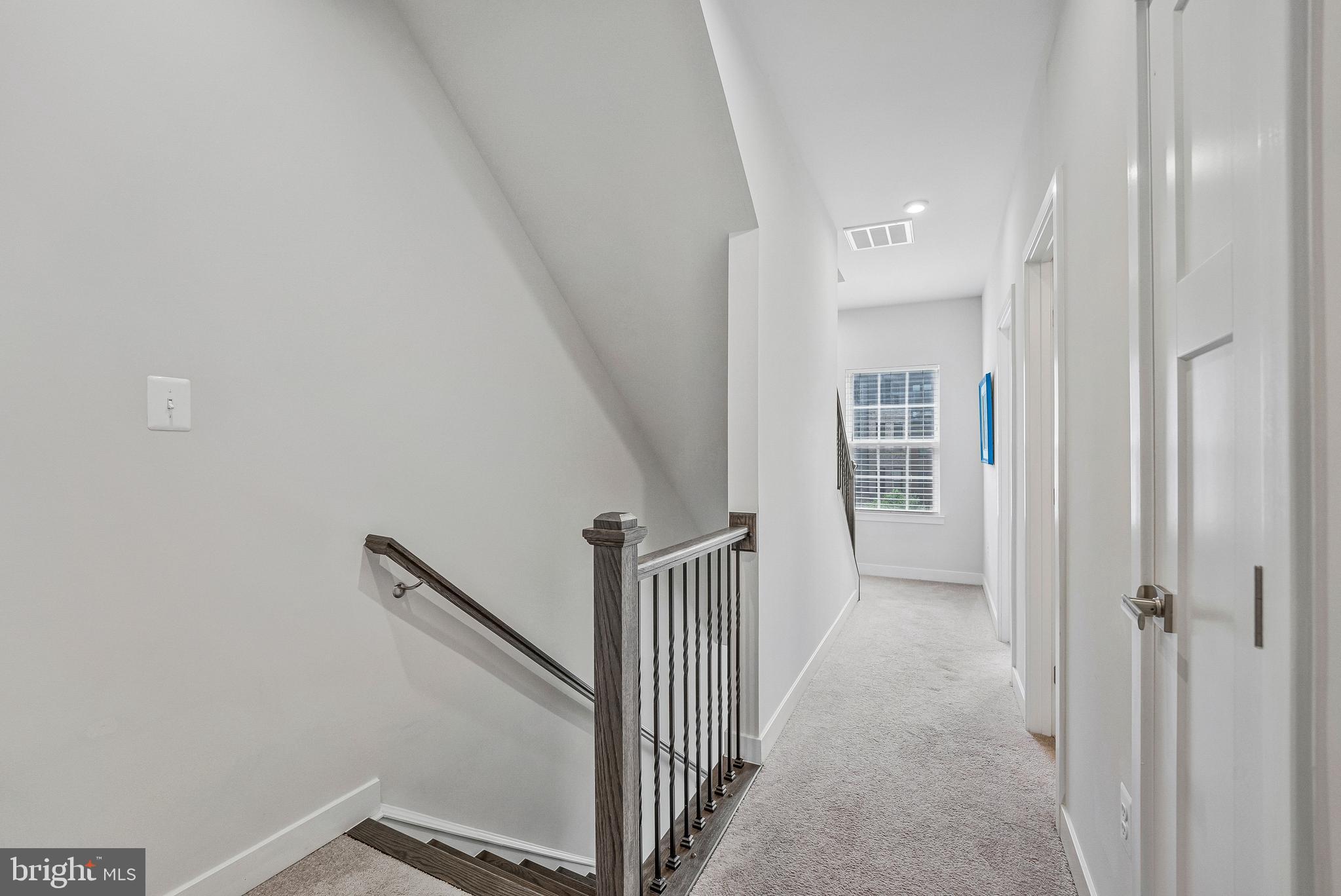 2736 Velocity Road Herndon, VA 20171 - Photo 17 of 42 Upgraded Staircase and Railings- 2nd Level Hallway