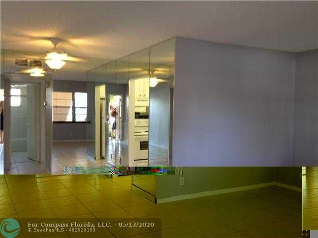 2131 Northeast 41st Street, Unit 104 Lighthouse Point, FL 33064 - Photo 3 of 6 Exterior Front