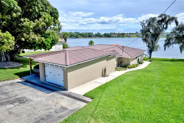 a aerial view of a house with a yard