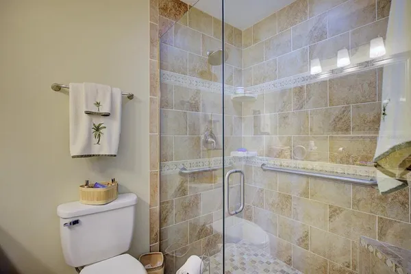 a bathroom with a toilet and shower