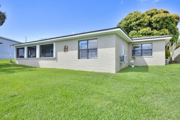 a house that is sitting in the grass